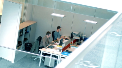 High angle shot of two engineers working at their desks