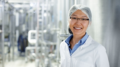 Women standing in a milk processing plant