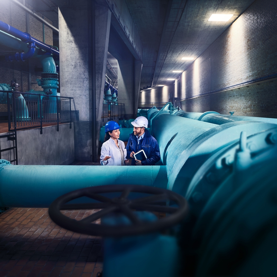 Engineers in front of a water distribution network