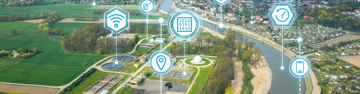 Dashboard von Netilion Water Network Insights vor einem Wasserbehälter