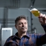Brewer holding beer