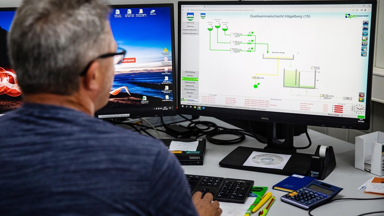 Water specialist monitors spring discharges from office.