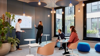 Group of Endress+Hauser employees collaborating in an inspiring atmosphere.